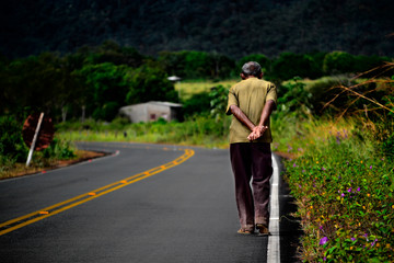 Man walking on country road