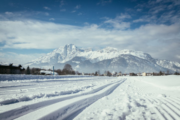 Cross-country skiing in Austria: Slope, fresh white powder snow and mountains