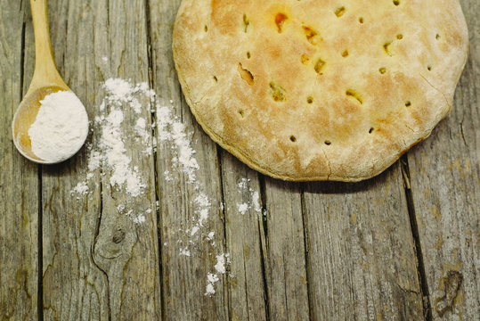 Pizza Calzone on old wooden table