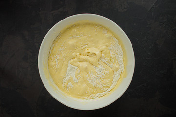 raw dough and apples (eggs, flour and other ingredients apples - Charlotte). food background. copy space