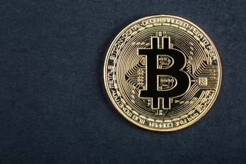 coin bitcoin close-up on a dark background