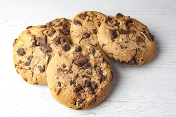 COOKIES WITH CHIPS OF CHOCOLATE ON WHITE BACKGROUND