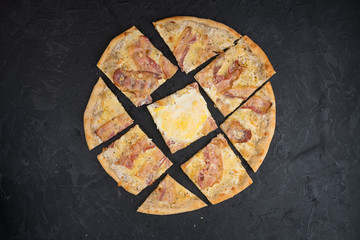 Italian pizza isolated on black background