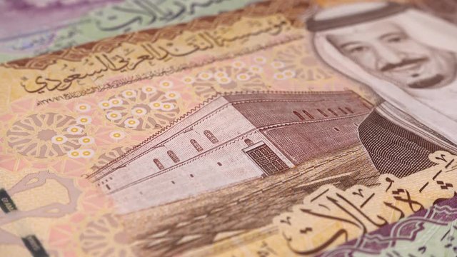 Saudi Arabia riyal notes rotating. Saudi Arabian money. Saudi Arabia economy. Low angle. Stock video footage