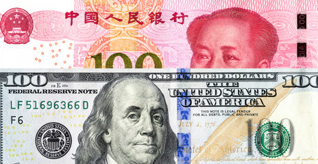 Chinese yuan banknote and american dollar