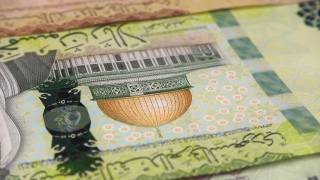 Saudi Arabia riyal notes rotating. Saudi Arabian money. Saudi Arabia economy. Low angle. Stock video footage