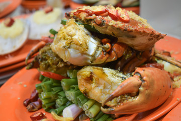 Boiled giant crab served on an orange plate at the Temple Street night market in Hong Kong China