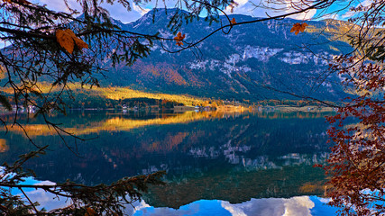 Beautiful panoramic view at Austrian alps lake. Old vintage rural houses and wooden boat houses in alps at Hallstatt mountain lake at blue hour. Location: resort village Hallstatt, Austria, Alps