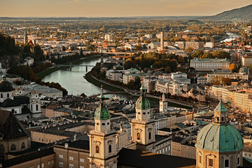 Beautiful sunset aerial view on Salzburg, Austria, Europe. City in Alps of Mozart birth. Panoramic view of Salzburg skyline from Festung Hohensalzburg in autumn. Famous town