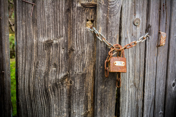 Old Wooden Doorway Secured with a Padlock