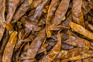 many fruits dried chili pili flat pod culinary design spices closeup light brown background