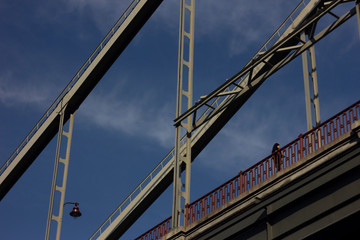 Metal parts of the bridge against the blue sky