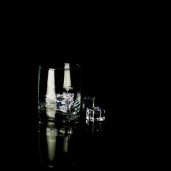Isolated shot of whiskey with splash on black background