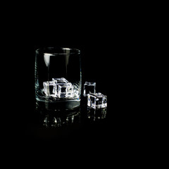 Isolated shot of whiskey with splash on black background