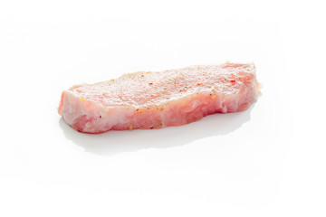 Raw pork meat on a white background