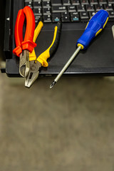 server assembly set pliers wire cutters screwdriver computer technology engineering background close-up
