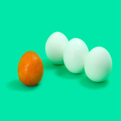 Mandarin of unusual shape and three eggs