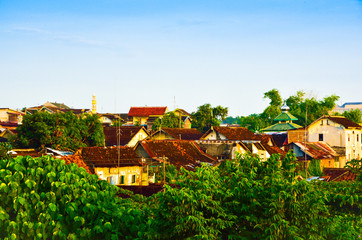 Colorful colourful residential buildings for city dwellers in the densely populated downtown city centre with green plantation and trees