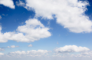 Fantastic view of the azure sky on a sunny day with fluffy clouds.