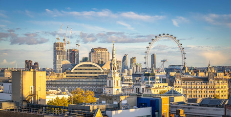 London skyline with London eye at cloudy day - obrazy, fototapety, plakaty