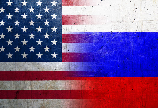 Russia and United States flags on the grunge metal background
