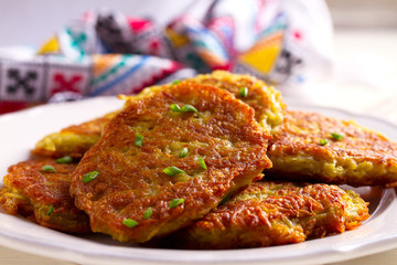 Potato Cakes. Vegetable fritters, latkes, draniki. Vegetable pancakes. horizontal