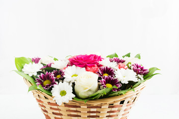 Basket of beautiful flowers for holiday with white background