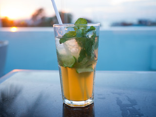 Glass of mojito cocktail outside in a bar
