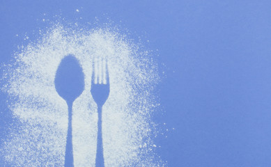  Can use as mockup for design.Top view of cutlery silhouette made with flour and powdered sugar on a bright purple paper background with space for text. Culinary art, flat lay