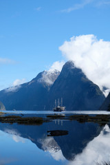 View over Milford Sound, Fjordland, New Zealand.  Peaks reflected in fjord.