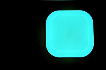 Turquoise square with beveled corners on black background. The bottom view image of the chandelier in the style modern.