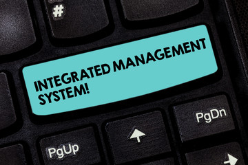 Text sign showing Integrated Management System. Conceptual photo combines all components of a business into one Keyboard key Intention to create computer message pressing keypad idea