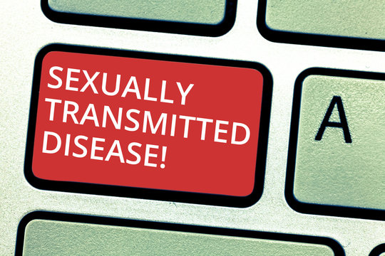 Text sign showing Sexually Transmitted Disease. Conceptual photo Diseases spread by sexual intercourse Keyboard key Intention to create computer message pressing keypad idea