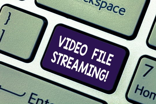 Conceptual hand writing showing Video File Streaming. Business photo showcasing video be viewed online without being downloaded Keyboard key Intention to create computer message idea