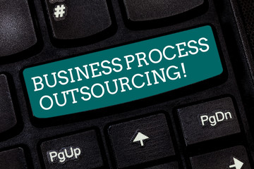 Writing note showing Business Process Outsourcing. Business photo showcasing Contracting work to external service provider Keyboard key Intention to create computer message pressing keypad idea