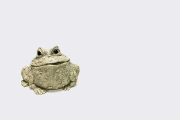 Frog figurine with white background smiling