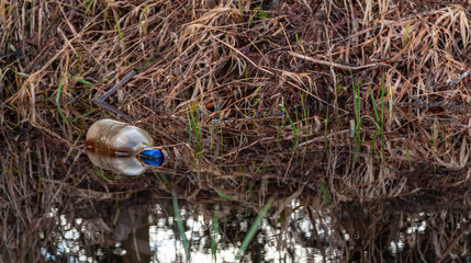 Bottle floating in the ditch