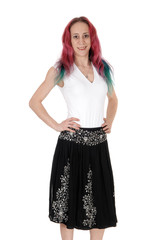 Young woman standing in a skirt and blouse
