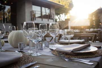 Elegant dinner table served on a garden 