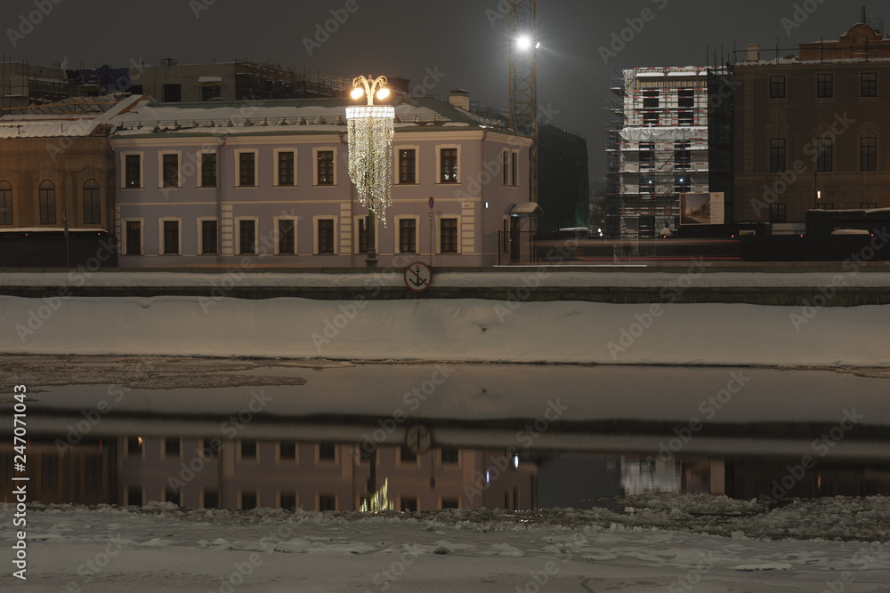 Wall mural The beauty of Moscow at winter night time. Moskva river embankment and medieval and ancient buildings brightly illuminated.