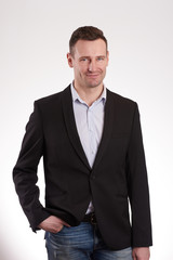 Young man in black jacket and jeans