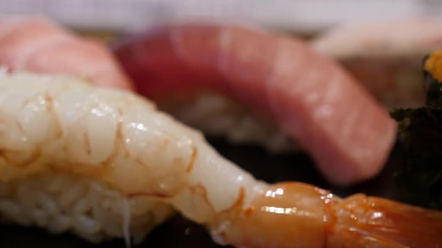 Japanese food: Delicious edomae sushi assortment, close up, filmed in 4K