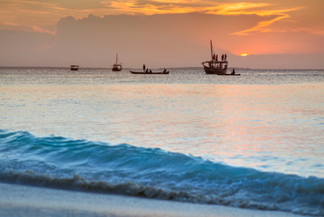 sunset with big boat and wave in Zanzibar