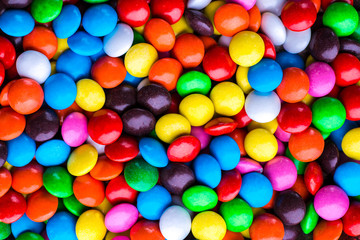 Fototapeta na wymiar Colorful chocolate candy pills.Candy variation color texture or background.top view