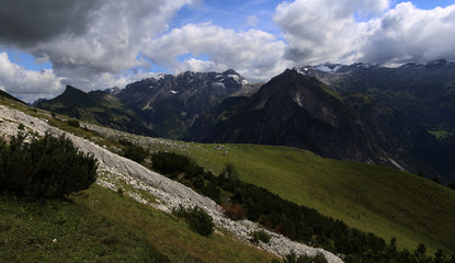 view of mountains with blue sky and white clouds