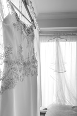 White wedding dress hanging up before the wedding