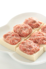 Chinese cooking, prepared mince meat on tofu