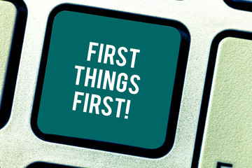 Fototapeta premium Word writing text First Things First. Business concept for important matters should dealt with before other things Keyboard key Intention to create computer message pressing keypad idea