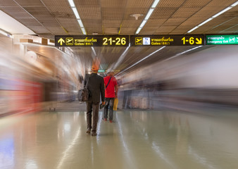 Motion blurred of passengers at Suvarnabhumi Airport terminal : Bangkok , Thailand