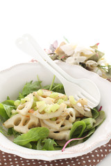 Pan fried lotus roots with leaf vegetable salad